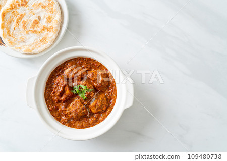 chicken tikka masala spicy curry meat food with roti or naan bread chicken tikka masala spicy curry meat food with roti or naan bread 109480738