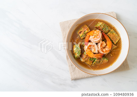 Sour soup made of Tamarind Paste with Shrimps and Vegetable Omelet Sour soup made of Tamarind Paste with Shrimps and Vegetable Omelet 109480936