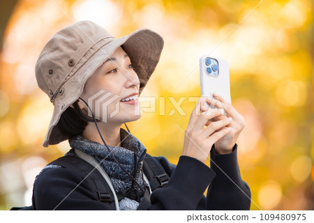 Hiking female yellow leaves Hiking female yellow leaves 109480975