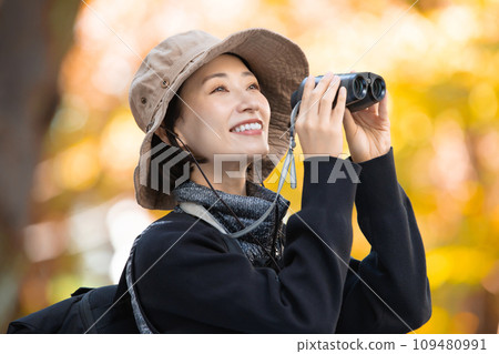 Hiking female yellow leaves 109480991