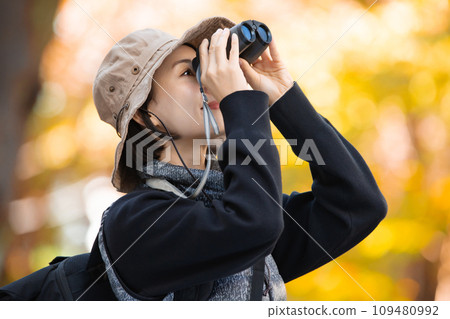 Hiking female yellow leaves 109480992