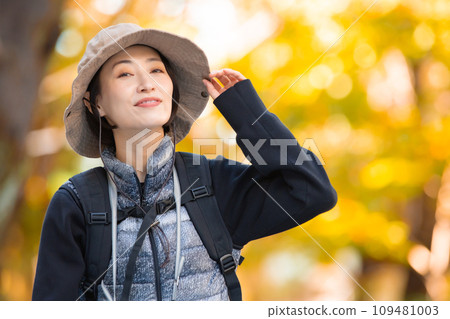 Hiking female yellow leaves Hiking female yellow leaves 109481003