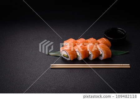 Delicious Philadelphia sushi roll with salmon, shrimp, cucumber and cream cheese 109482118