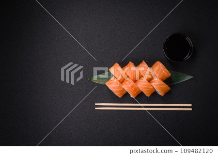 Delicious Philadelphia sushi roll with salmon, shrimp, cucumber and cream cheese 109482120