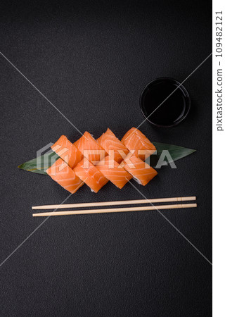 Delicious Philadelphia sushi roll with salmon, shrimp, cucumber and cream cheese Delicious Philadelphia sushi roll with salmon, shrimp, cucumber and cream cheese 109482121