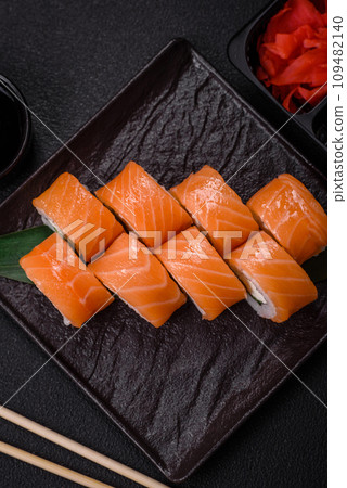 Delicious Philadelphia sushi roll with salmon, shrimp, cucumber and cream cheese 109482140