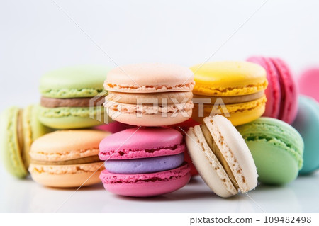 Multicolored macaroons spread out on a white table Multicolored macaroons spread out on a white table 109482498