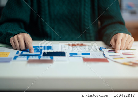 Creative male web designer planning application development for web mobile phone at modern workplace. Creative male web designer planning application development for web mobile phone at modern workplace. 109482818