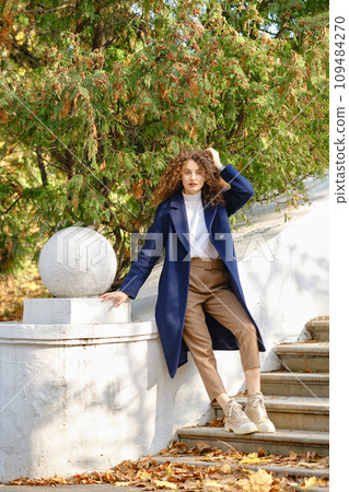 Autumn portrait of young woman in casual outfit Autumn portrait of young woman in casual outfit 109484270