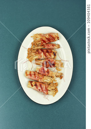 Enoki mushroom appetizer fried in bacon 109484381