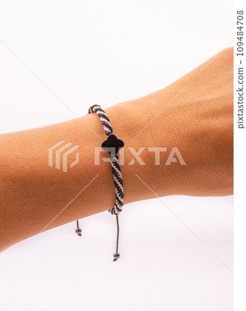 Buddhist bracelet shamballa with gems on a white background Buddhist bracelet shamballa with gems on a white background 109484708