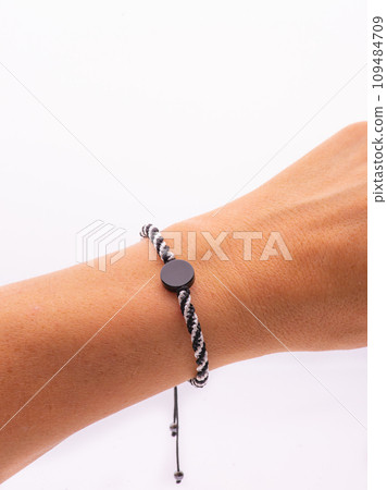 Buddhist bracelet shamballa with gems on a white background 109484709