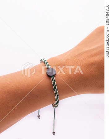 Buddhist bracelet shamballa with gems on a white background 109484710