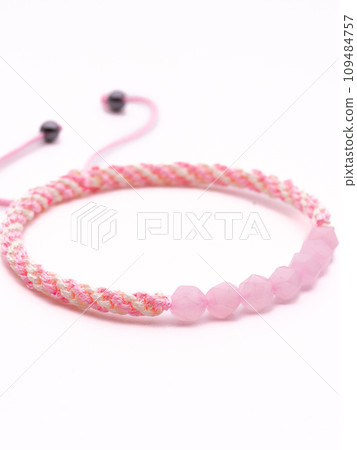 Woman hand with bracelets show thumb up symbol isolated on white background ,clipping path included for design. Woman hand with bracelets show thumb up symbol isolated on white background ,clipping path included for design. 109484757
