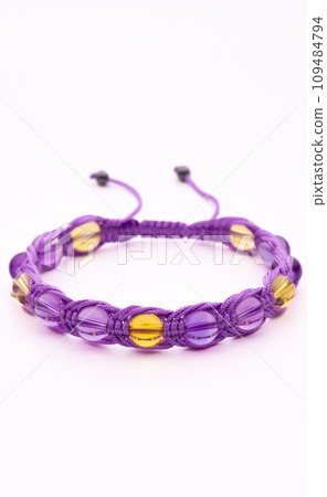 Woman hand with bracelets show thumb up symbol isolated on white background ,clipping path included for design. 109484794