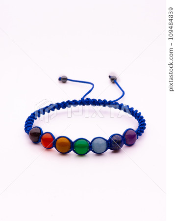 Woman hand with bracelets show thumb up symbol isolated on white background ,clipping path included for design. 109484839