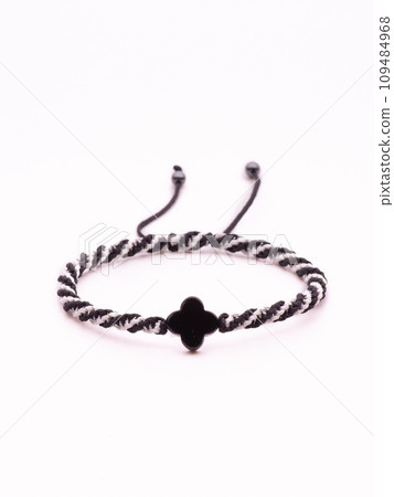 Buddhist bracelet shamballa with gems on a white background 109484968