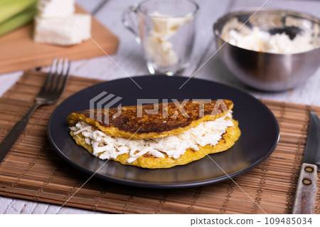 Corn cachapas with white cheese, typical Venezuelan dish. Corn cachapas with white cheese, typical Venezuelan dish. 109485034