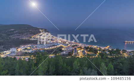 Aerial view of the coastline of the village of Sesimbra day to night timelapse. Portugal Aerial view of the coastline of the village of Sesimbra day to night timelapse. Portugal 109485156