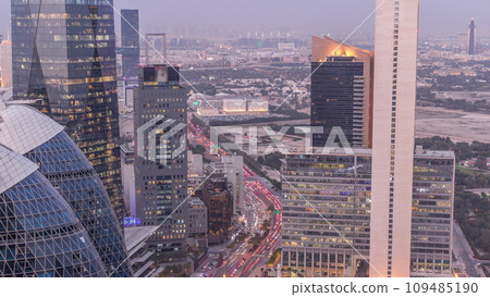 Skyline view of the high-rise buildings in International Financial Centre in Dubai aerial day to night timelapse, UAE. 109485190