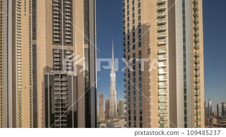 Tallest skyscrapers in downtown dubai located on boulevard street near shopping mall aerial night to day timelapse. 109485237