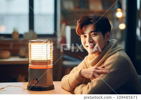 "AI-generated image" of a young man warming himself in front of a heater "AI-generated image" of a young man warming himself in front of a heater 109485671