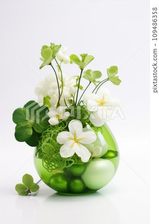 Green clover leaves in a vase isolated on white background 109486358