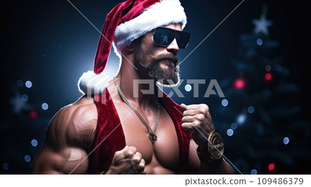 A muscular man in a Christmas hat and sunglasses. Festive lights and sparkles at the backgrounds 109486379