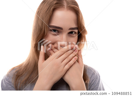 Modest teenage girl with blond hair and braces on a white background 109488851