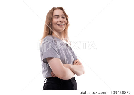 Cute teenage girl with blond hair on a white background 109488872
