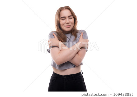 European teenager girl with blond hair and braces on a white background with copy space European teenager girl with blond hair and braces on a white background with copy space 109488885