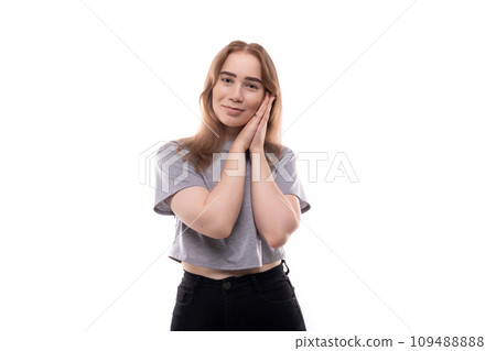 Cute teenage girl with blond hair on a white background 109488888