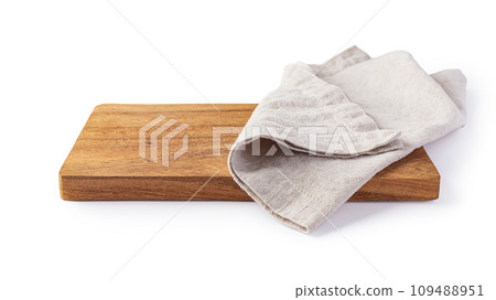 Linen napkin on wood plate isolated on white background 109488951