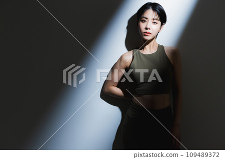 A woman wearing training wear A woman wearing training wear 109489372