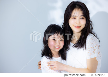 Girl hugging her mother 109489456