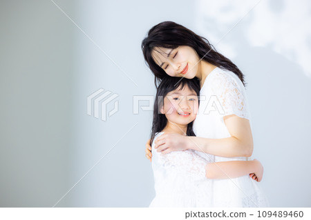 Girl hugging her mother 109489460