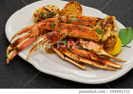 Baked snow crab with cajun spices Baked snow crab with cajun spices 109491733