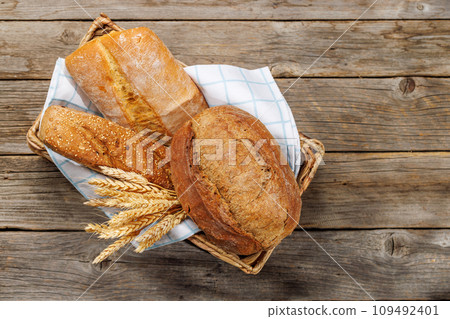 Assorted bread varieties in a basket Assorted bread varieties in a basket 109492401