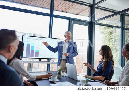 Presentation, meeting and planning with a senior business man talking to his strategy team in the boardroom at work. Training in a workshop or seminar with professional and corporate colleagues 109494412