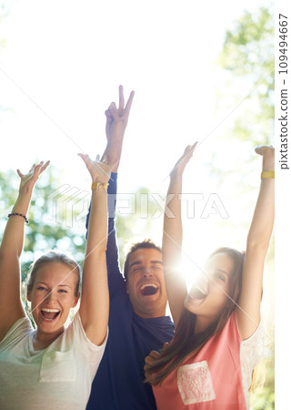 Portrait, outdoor and friends with party, excited and social event with music festival, happiness or summer. Face, people or group with lens flare, sunshine or weekend break with celebration or smile 109494667