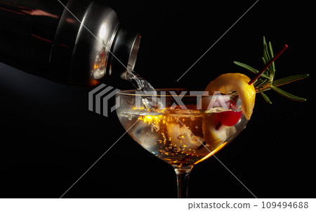 Martini with cherry, rosemary, and lemon. Martini with cherry, rosemary, and lemon. 109494688