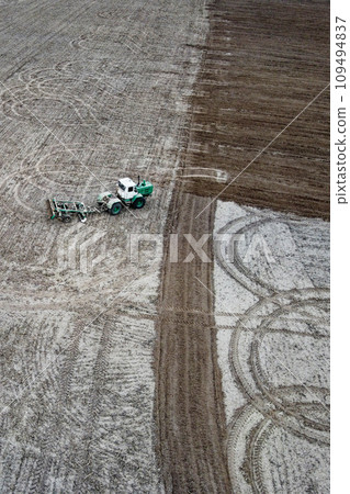 Tractor plows a field, aerial view. Agricultural landscape. 109494837