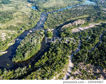 Winding bed of the Southern Bug river. River, landscape from a bird's eye view. Rough, rocky terrain. 109494867