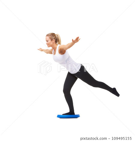 Balance, workout and fitness with woman on disk in studio for health, mindfulness or exercise. Wellness, challenge and training with person on white background for flexibility, smile or aerobics Balance, workout and fitness with woman on disk in studio for health, mindfulness or exercise. Wellness, challenge and training with person on white background for flexibility, smile or aerobics 109495155