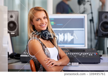 Audio engineer woman, portrait and smile by computer, mixer and pride in recording studio for music. Musician, artist and producer with sound tech for wave analysis, happy or entertainment industry 109495761