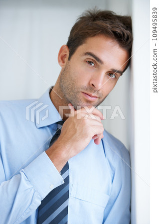 Thinking, wall and portrait of business man in office with confidence, pride and ambition. Corporate, professional and face of entrepreneur with ideas for company, career and job in workplace 109495839