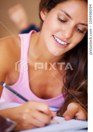 Female student and writing in diary in bedroom with idea for vision of future. Young, woman and creative with notebook for journaling, goals or aspiration in home for peace, wellness or relaxing Female student and writing in diary in bedroom with idea for vision of future. Young, woman and creative with notebook for journaling, goals or aspiration in home for peace, wellness or relaxing 109496094