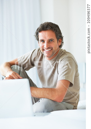 Portrait, happy man in bedroom and laptop to work from home, smiling and sitting in bed for freelance job. Technology, Entrepreneur and remote worker for online job, company and marketing projects Portrait, happy man in bedroom and laptop to work from home, smiling and sitting in bed for freelance job. Technology, Entrepreneur and remote worker for online job, company and marketing projects 109496377
