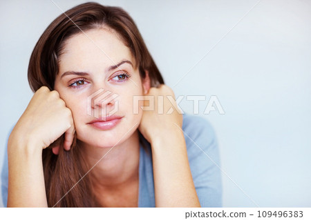 Rest, thinking and face of woman in bedroom for sleeping, dreaming and comfortable at home. Wondering, thoughtful and person in relax, reflect and wake up for health, wellness and calm in morning 109496383