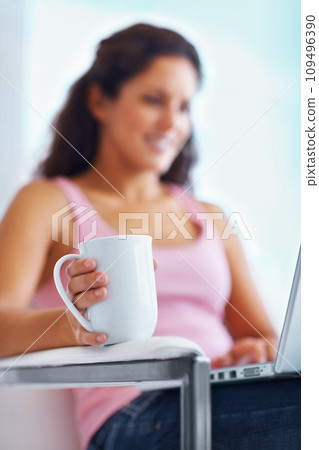 Coffee, home and woman typing on laptop for remote working, freelance career and relax on break. Happy, morning and person on computer with warm beverage for internet, website research and blog Coffee, home and woman typing on laptop for remote working, freelance career and relax on break. Happy, morning and person on computer with warm beverage for internet, website research and blog 109496390
